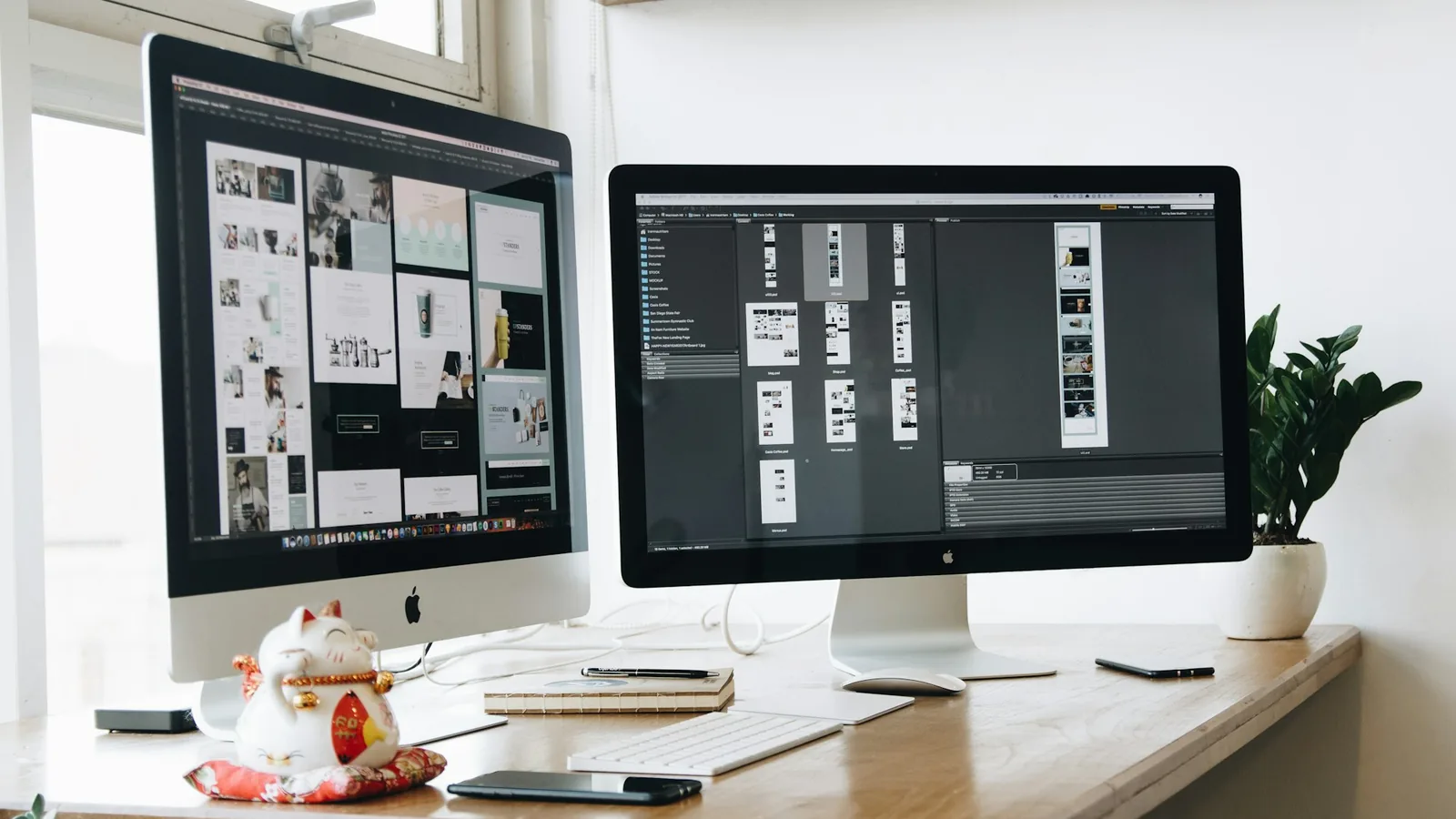 Dual-monitor workstation showing a website mockup